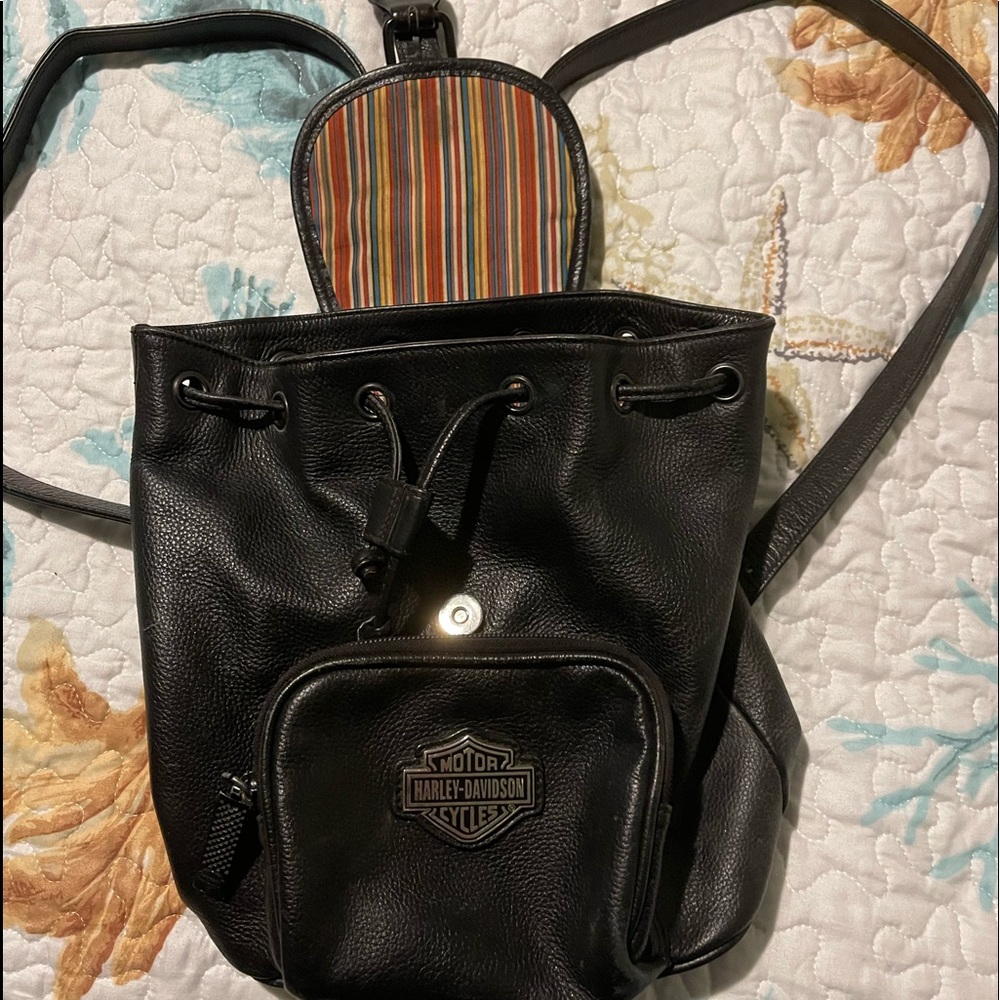 HD backpack with drawstring and snap closure with front pocket